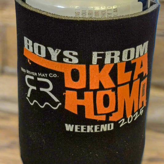 Black can cooler with 'Boys from Oklahoma' text and branding on a wooden surface