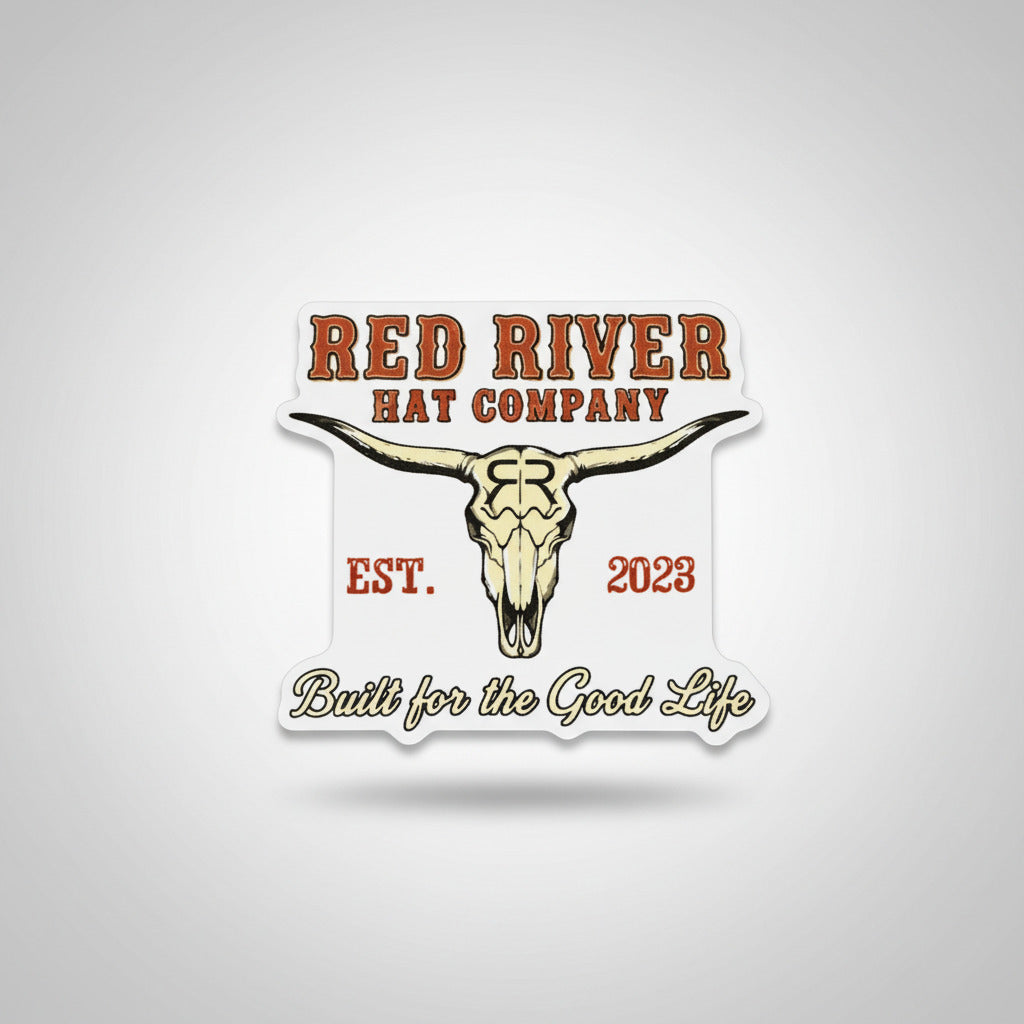 Sticker with 'Red River Hat Company' logo and text on a textured surface