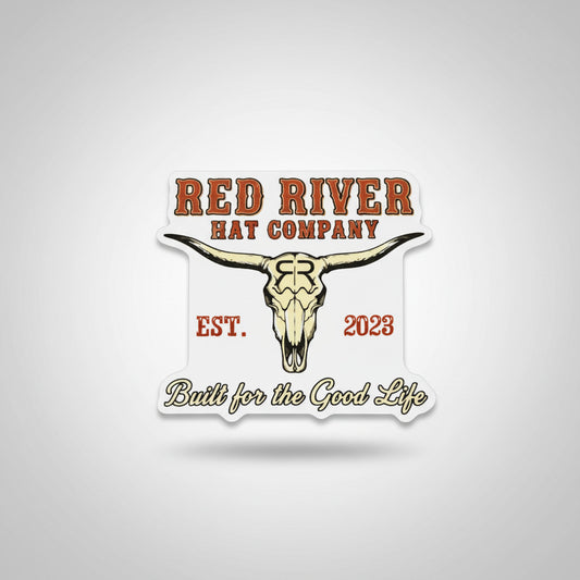 Sticker with 'Red River Hat Company' logo and text on a textured surface